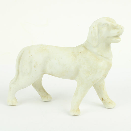 Antik porcelænsfigur i bisquit(uglaseret brændt porcelæn) i form af hund