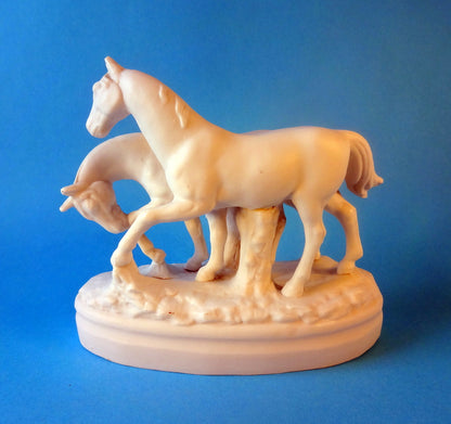 Lille tysk figurgruppe forestillende to heste